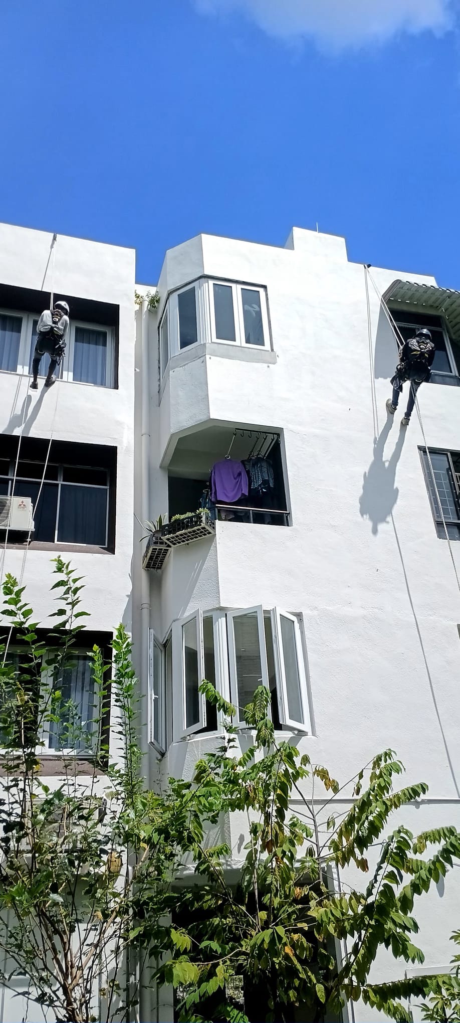 Angled facade and projecting windows at Jalan Labu Ayer