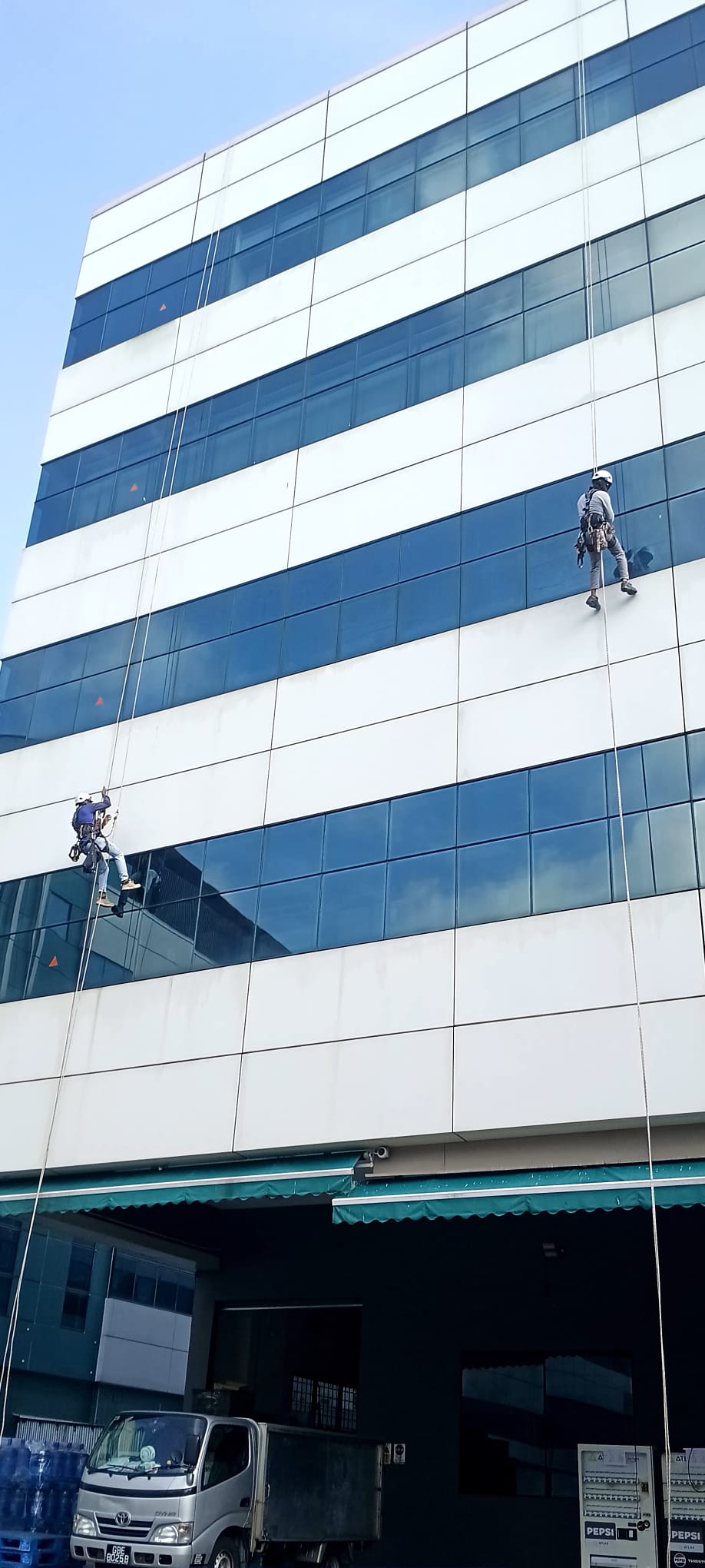White facade and blue glazing at the Kaki Bukit View inspection site